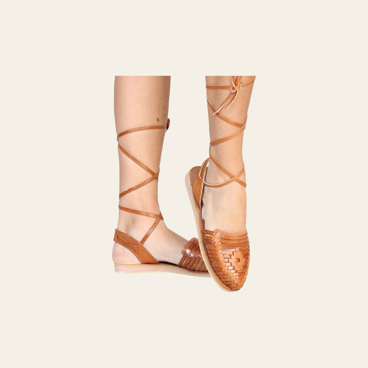 Mexican Artisanal Sandals Leather Natural 602367 on a warm cream background
