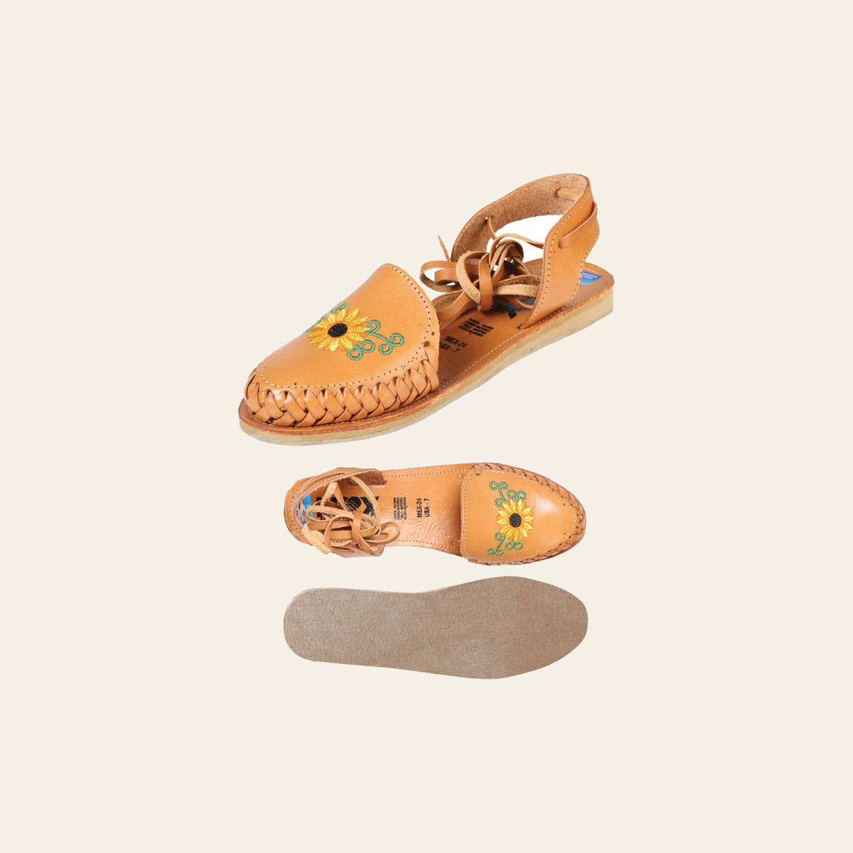 Mexican Artisanal Sandals Leather Tan 603920 on a warm cream background