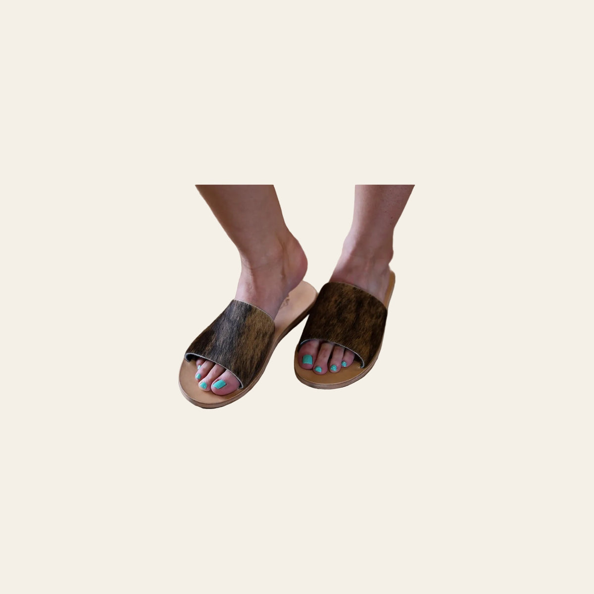 Nadia Cowhide | Slides on a warm cream background