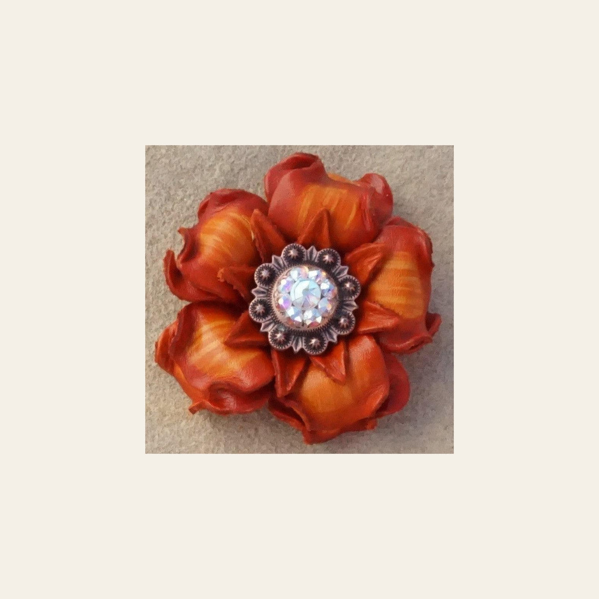 Orange Gardenia Flower With Copper AB 1" Concho on a warm cream background