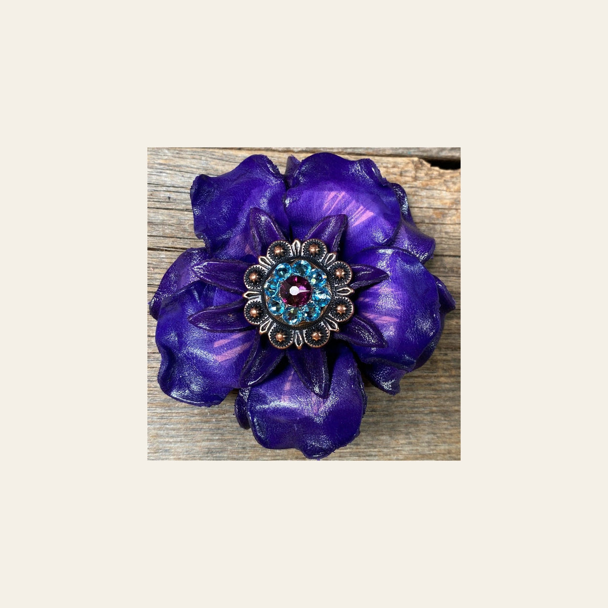 Purple Gardenia Flower With Copper Amethyst & Aqua 1" Concho on a warm cream background