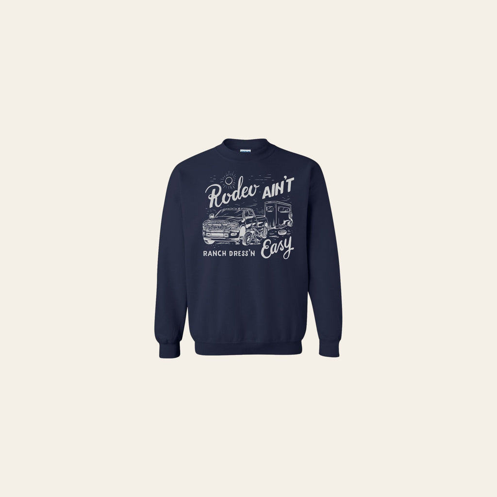 Rodeo Ain't Easy Navy Crewneck on a warm cream background