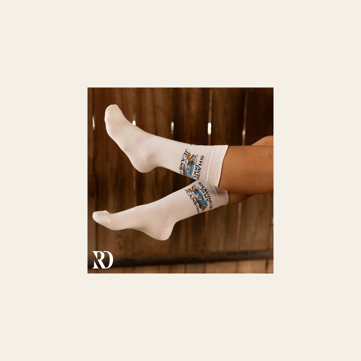 Shavings In My Jeans Club Socks on a warm cream background