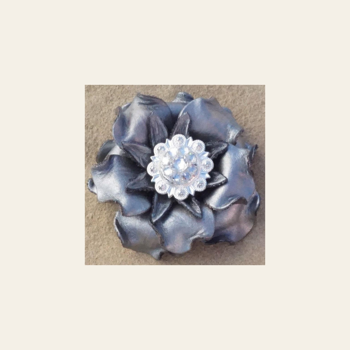 Silver Gardenia Flower With Bright Silver Clear 1" Concho on a warm cream background