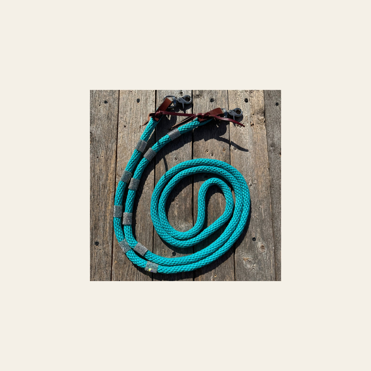 Teal Nylon Barrel Racing Reins with Rhinestones #BNR109 on a warm cream background