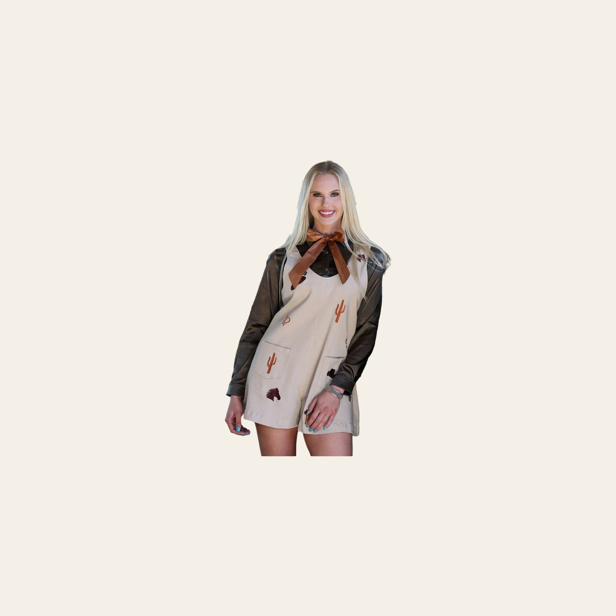 Traildust | Romper on a warm cream background