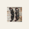Western Dark Oil Rustic Tie Down Keepers on a warm cream background