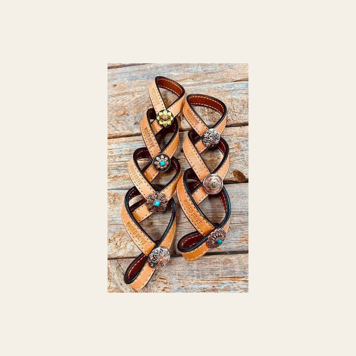 Western Light Oil Rustic Tie Down Keepers on a warm cream background