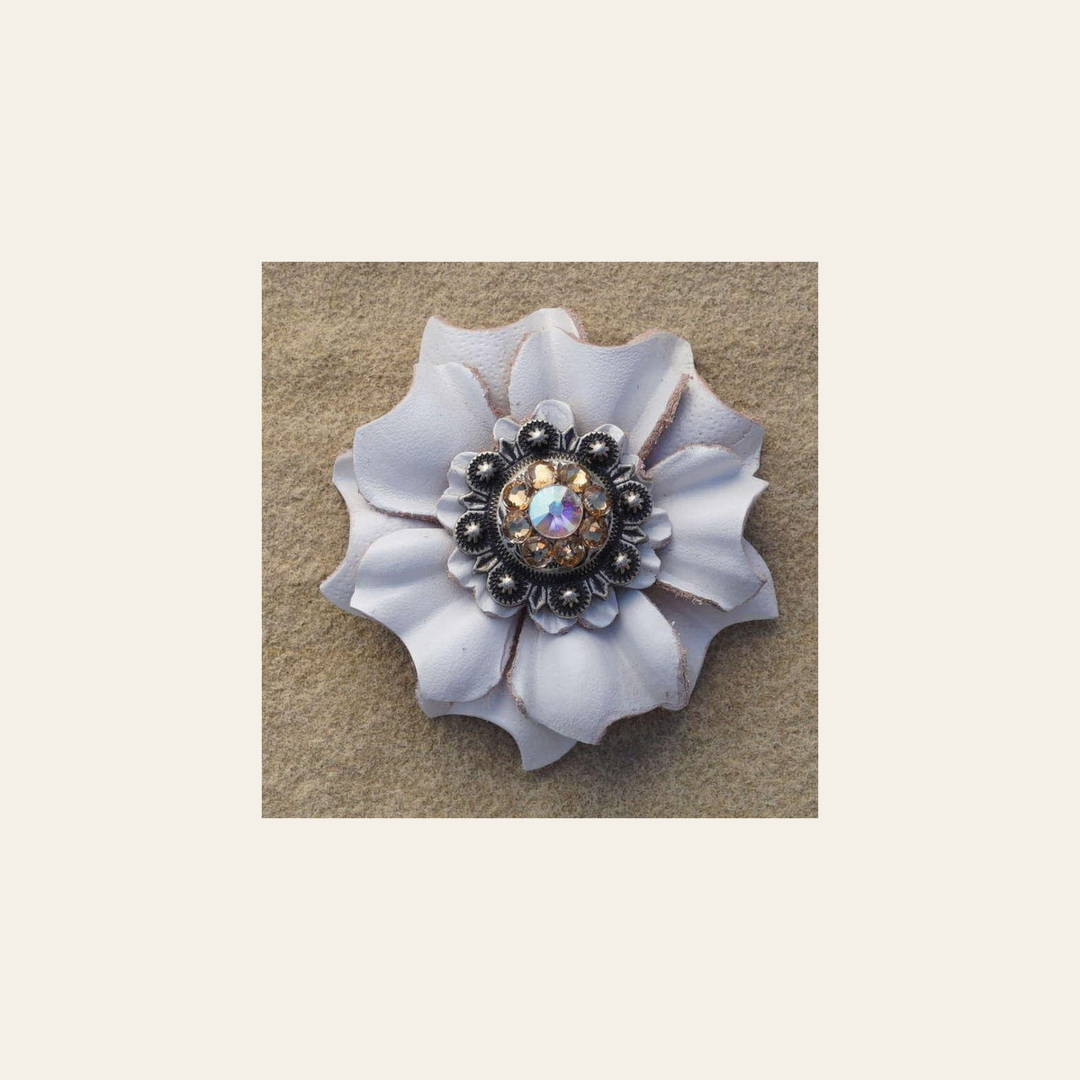White Carnation Flower With Antique Silver Champagne and AB 1" Concho on a warm cream background