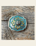A Touch of Turquoise Concho 1.5" W109L on a warm cream background