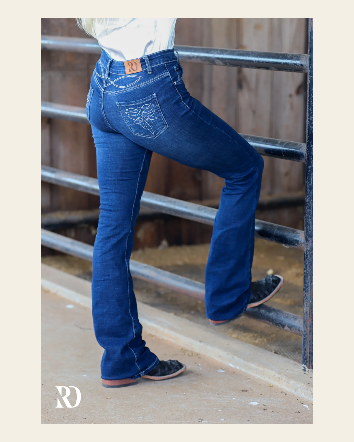 Addison Bootcut - Medium Wash on a warm cream background