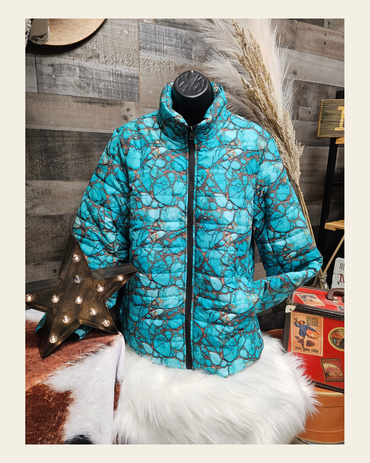 All Turquoise Women's Puffy Bomber Jacket on a warm cream background