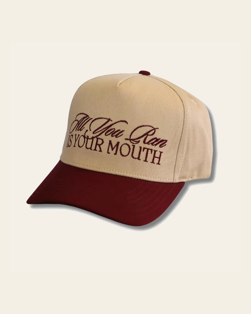 All You Run Is Your Mouth Hat on a warm cream background