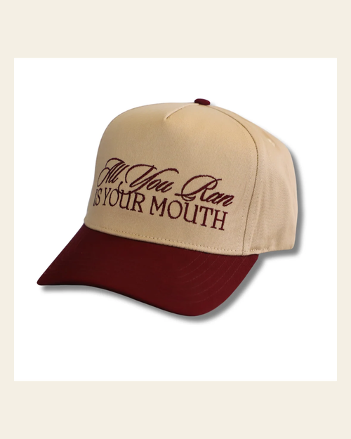 All You Run Is Your Mouth Hat on a warm cream background