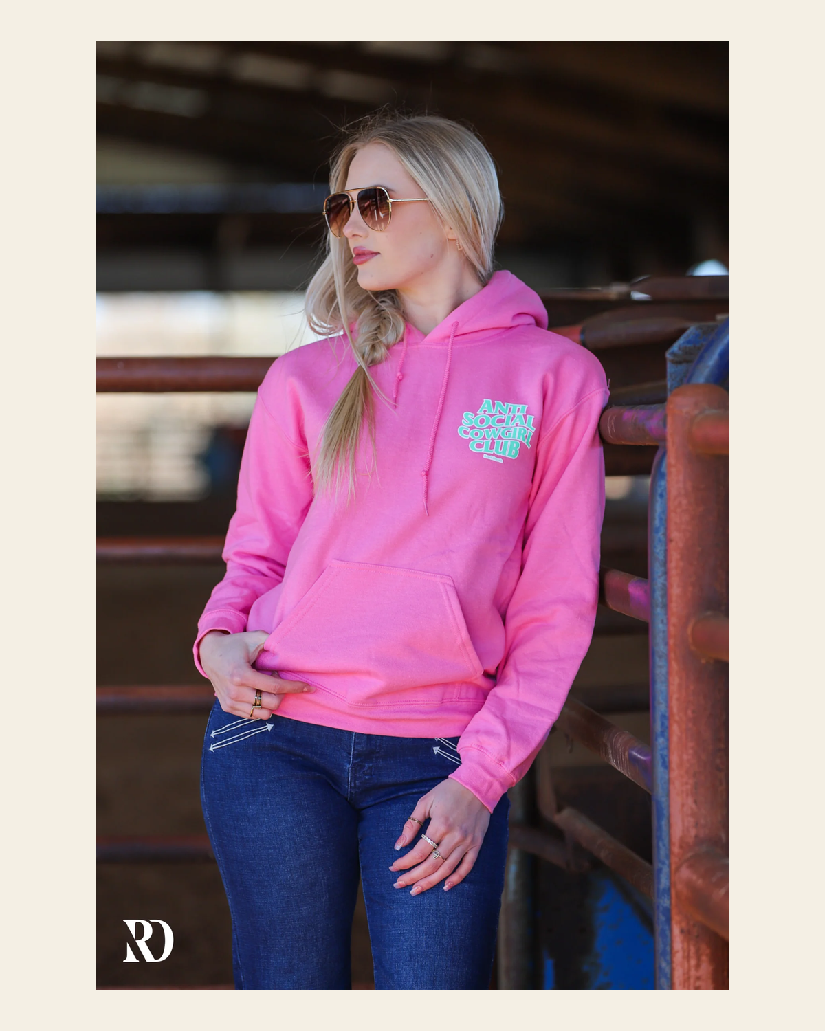 Anti Social Cowgirl Club Hoodie - Neon Pink on a warm cream background