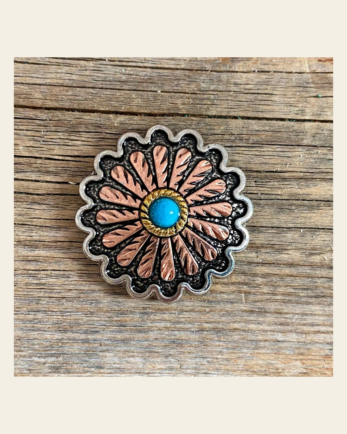 Antique Silver and Copper Floral Western Concho 1.25" W220L on a warm cream background