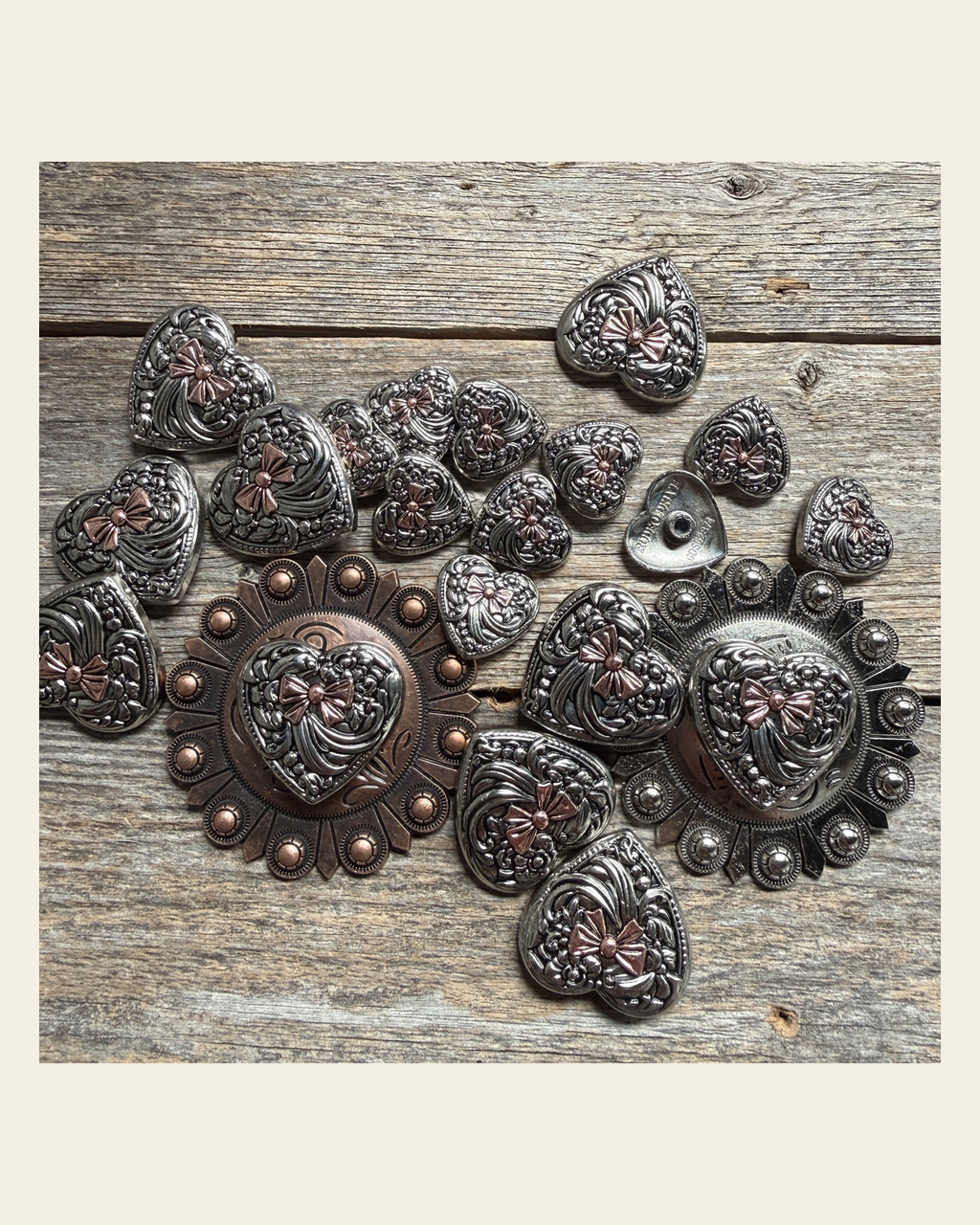 Antique Silver and Copper Heart Concho W263 on a warm cream background