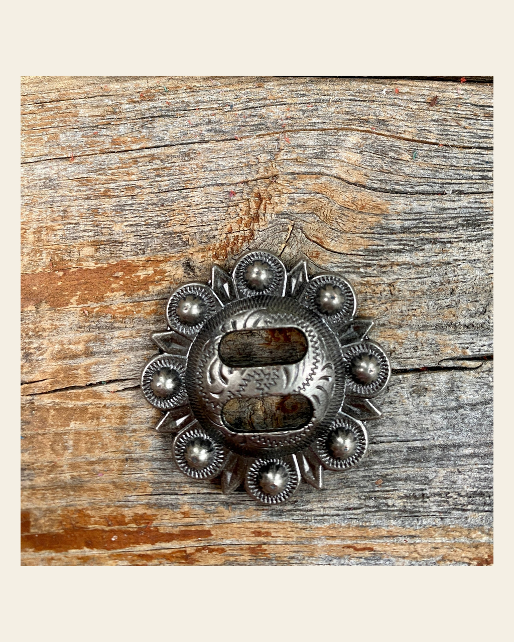 Antique Silver Berry Slotted Concho 1.5" W173L on a warm cream background