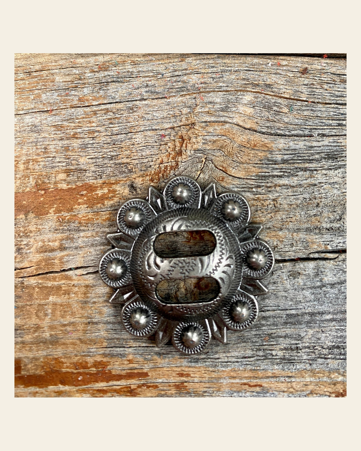 Antique Silver Berry Slotted Concho 1.5" W173L on a warm cream background