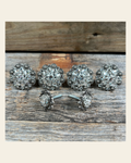 Antique Silver Clear Saddle Conchos on a warm cream background