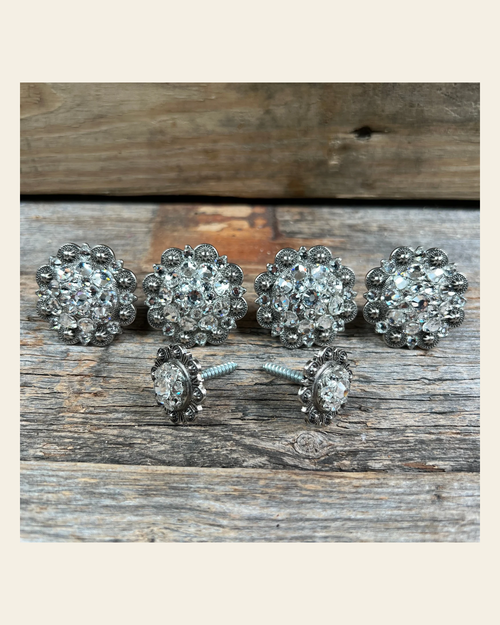Antique Silver Clear Saddle Conchos on a warm cream background
