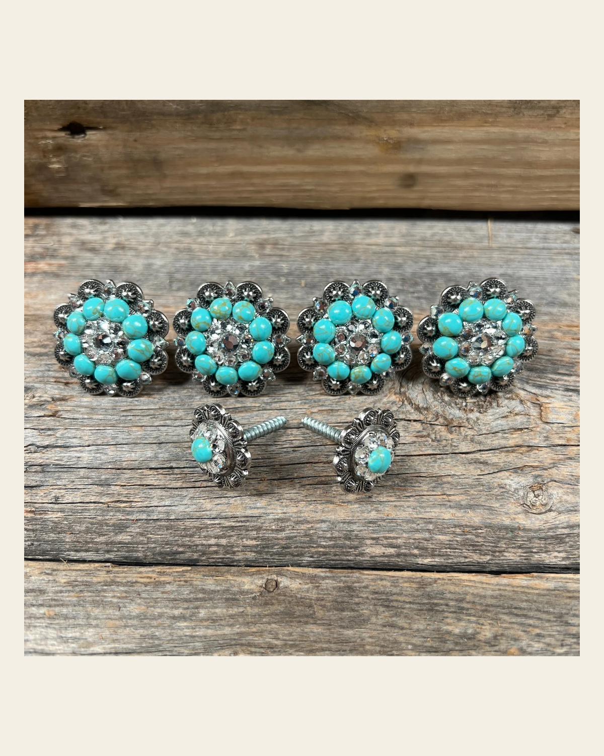 Antique Silver Fashion Turquoise and Clear Saddle Conchos on a warm cream background