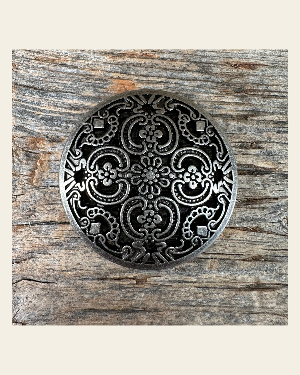 Antique Silver Floral Engraved Concho 1.5" W225L on a warm cream background