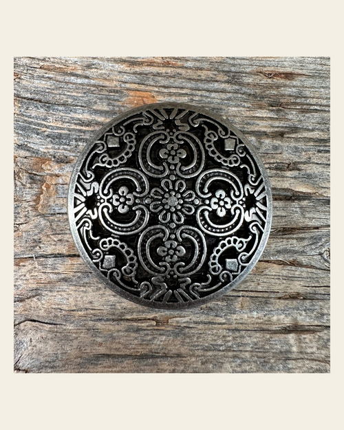 Antique Silver Floral Engraved Concho 1.5" W225L on a warm cream background
