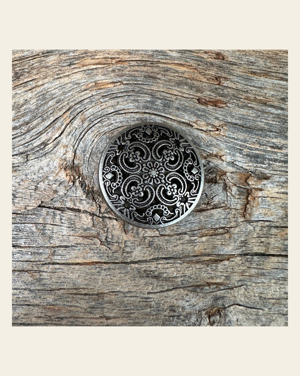 Antique Silver Floral Engraved Concho 1" W225S on a warm cream background