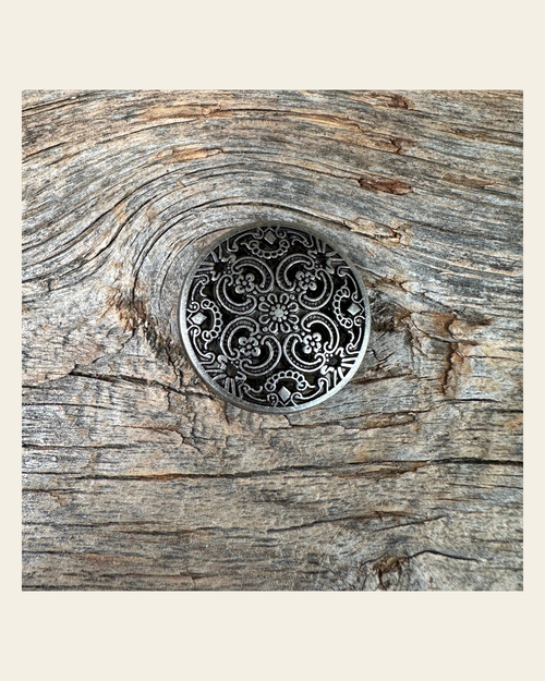Antique Silver Floral Engraved Concho 1" W225S on a warm cream background