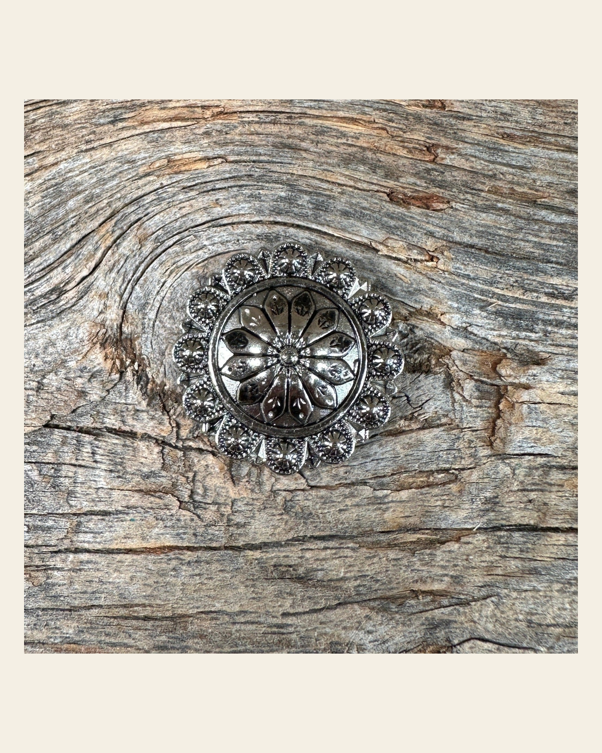 Antique Silver Flower and Berry Concho 1" W226S on a warm cream background
