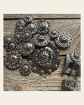 Antique Silver Flower and Berry Western Concho W226 on a warm cream background