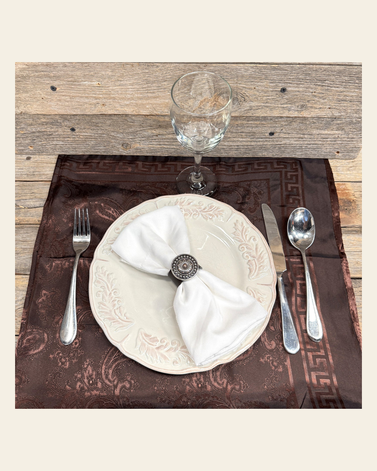 Antique Silver Flower and Dots Western Concho Napkin Ring #CNR106 on a warm cream background