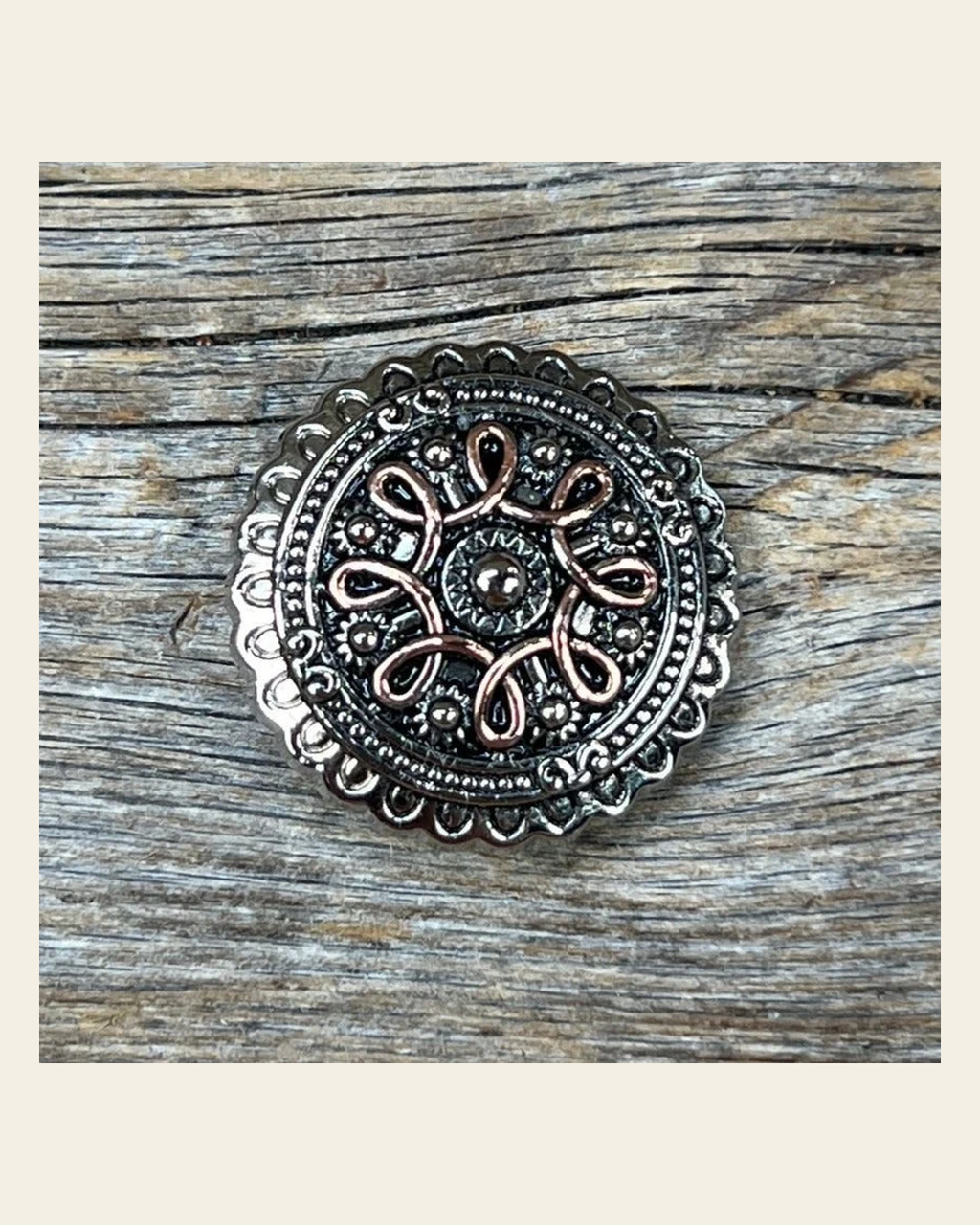 Antique Silver Flower and Loops Concho 1.5" W235L on a warm cream background