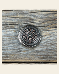 Antique Silver Flower and Loops Concho 1" W235S on a warm cream background