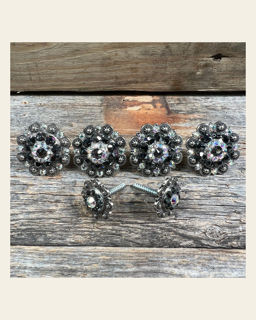 Antique Silver Jet & AB Saddle Conchos on a warm cream background