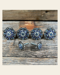 Antique Silver Light Sapphire Clear & Lilac Saddle Conchos on a warm cream background