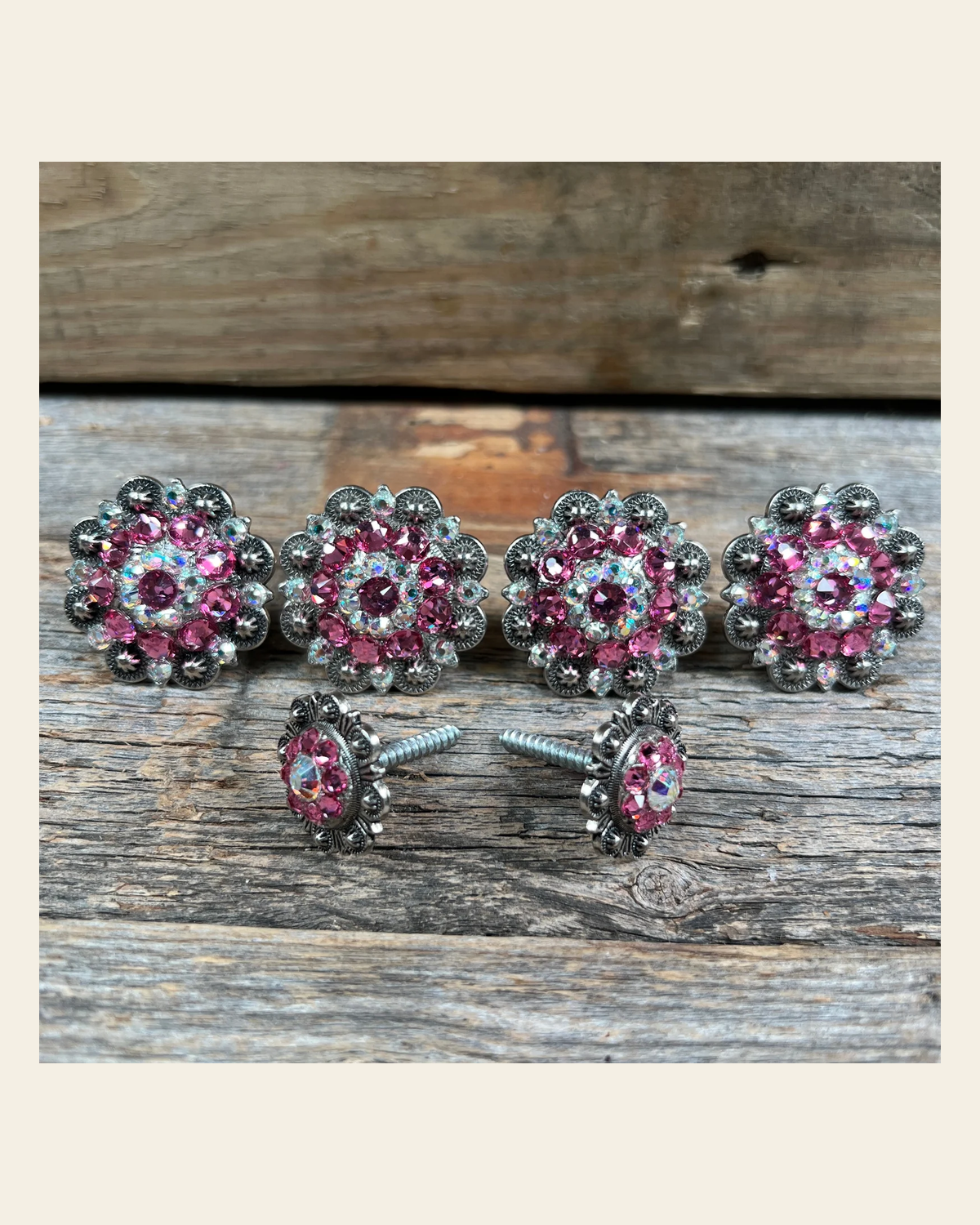 Antique Silver Pink & AB Saddle Conchos on a warm cream background