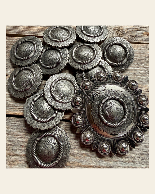 Antique Silver Round Western Concho W102 on a warm cream background