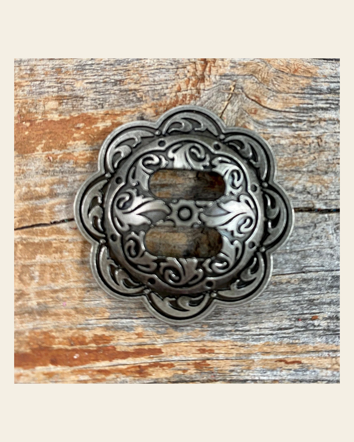 Antique Silver Scalloped Slotted Concho 1.5" W165AL on a warm cream background