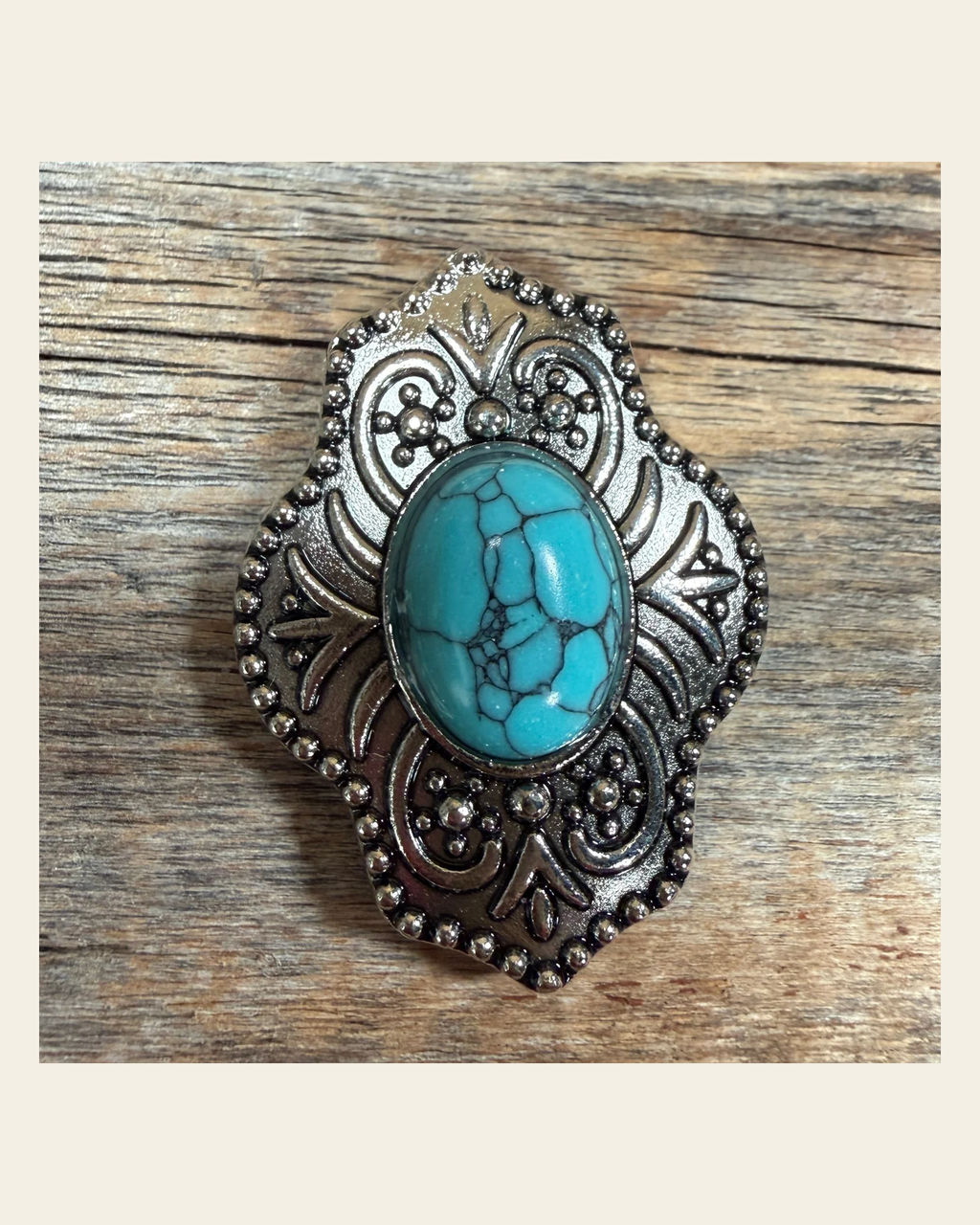 Antique Silver Shield with Turquoise Stone Western Concho W252L on a warm cream background