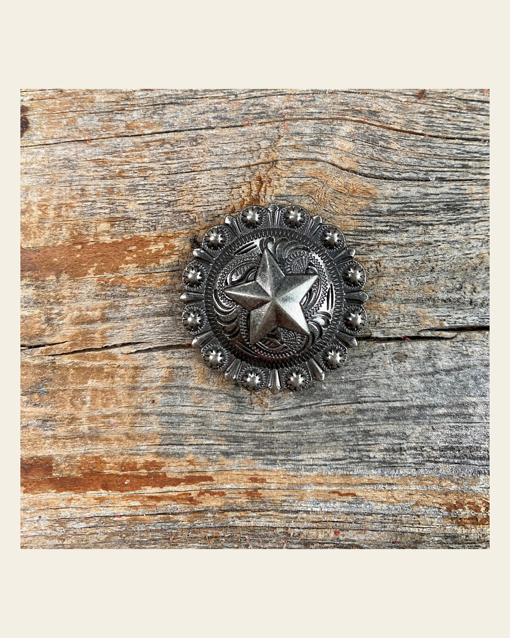 Antique Silver Star Concho 1.25" W174L on a warm cream background