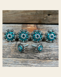 Antique Silver Teal & AB Saddle Conchos on a warm cream background