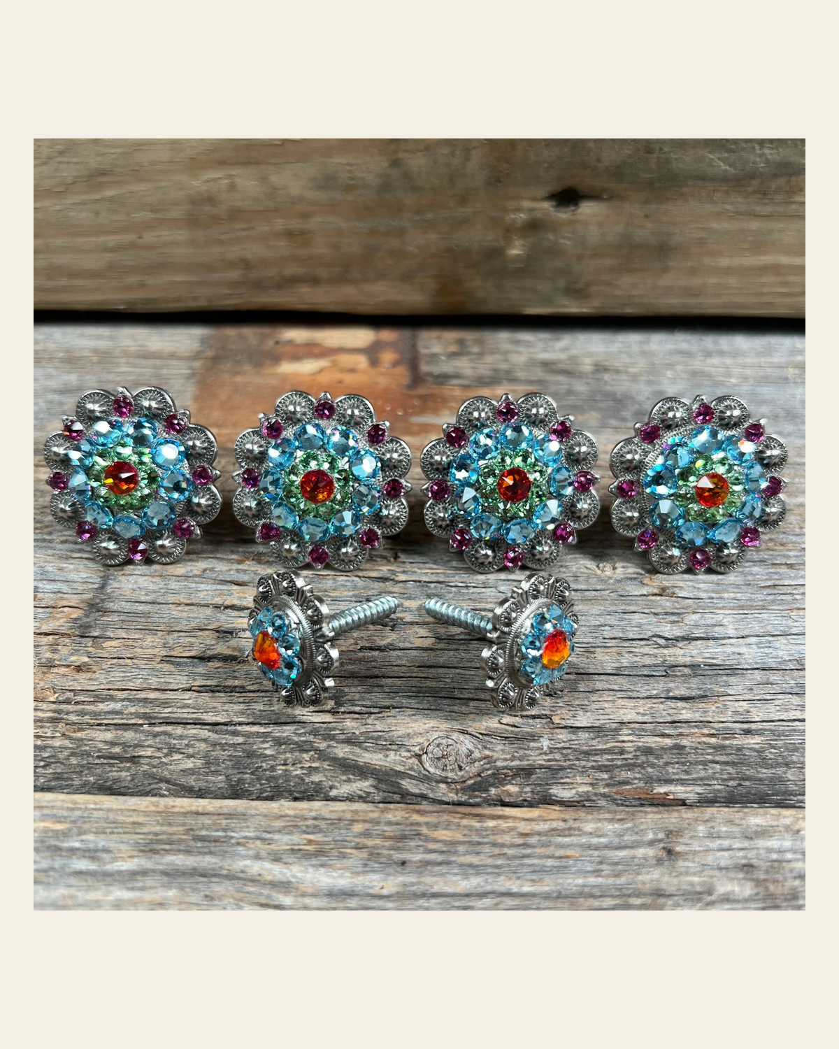 Antique Silver Tie-Dye Saddle Conchos on a warm cream background
