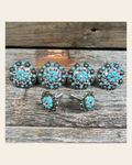 Antique Silver Turquoise & AB Saddle Conchos on a warm cream background
