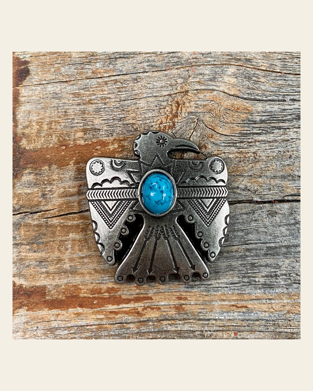 Antique Silver Turquoise Thunderbird Concho 1.5" W181L on a warm cream background
