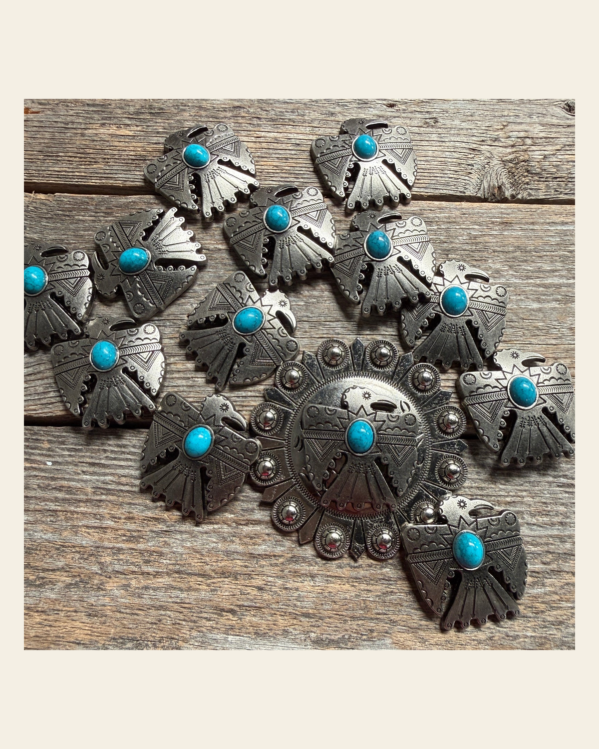 Antique Silver Turquoise Thunderbird Concho W181 on a warm cream background