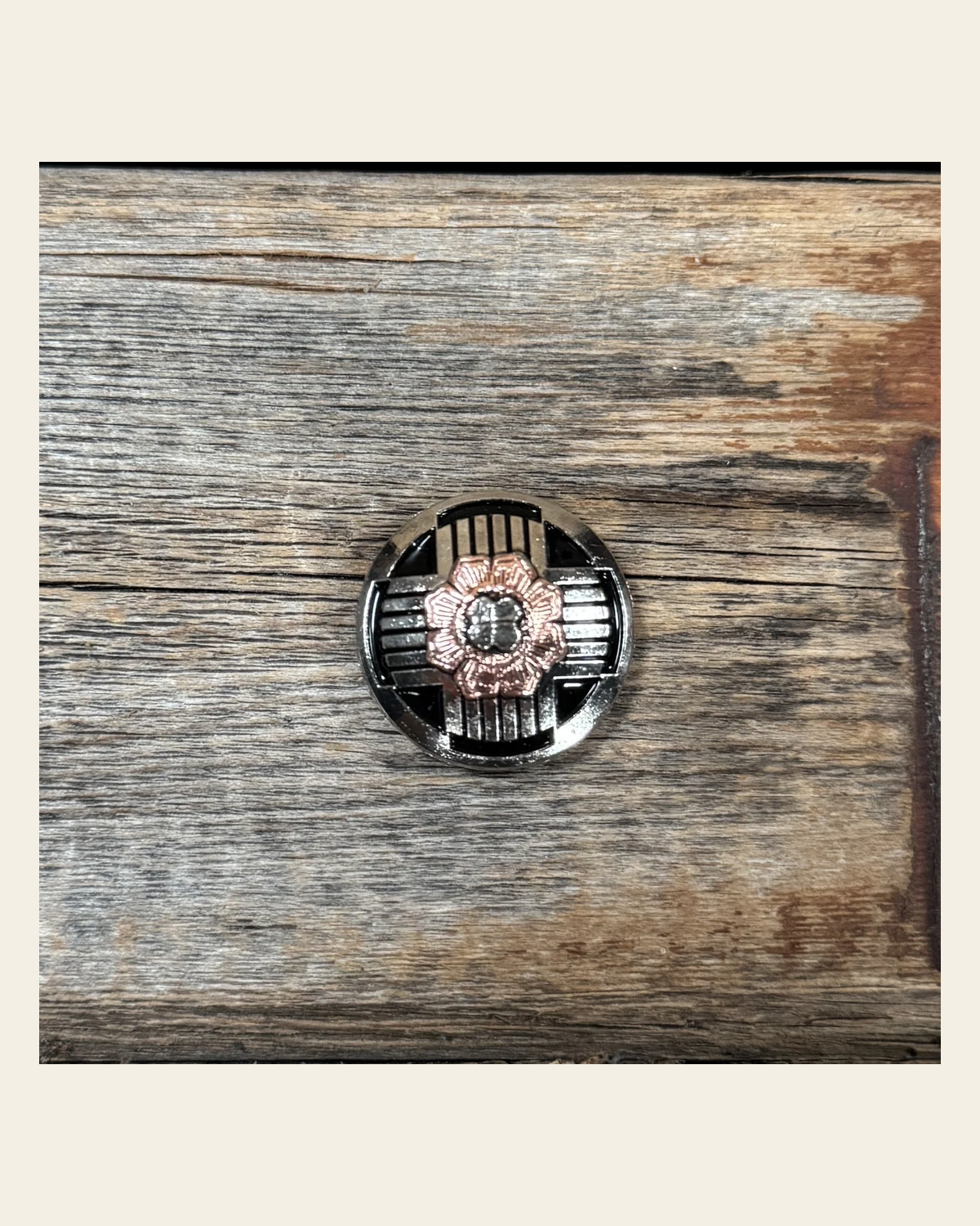 Antique Silver with Copper Flower 1" Concho W217S on a warm cream background