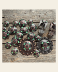 Antique Silver with Copper Flower Western Concho W190 on a warm cream background