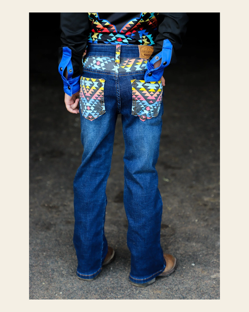 *youth* Arizona Bootcut Denim Jeans on a warm cream background